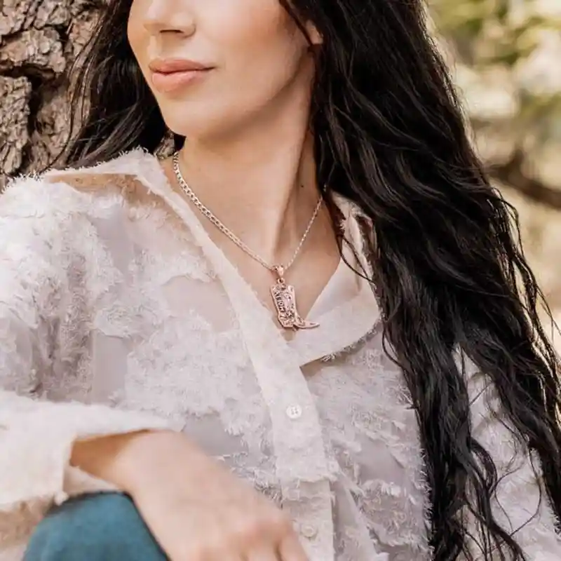 Woman wearing a silver boot shaped custom pendant necklace